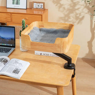 Catomi wooden desk cat bed in Natural with a soft grey cushion, mounted over a home office desk